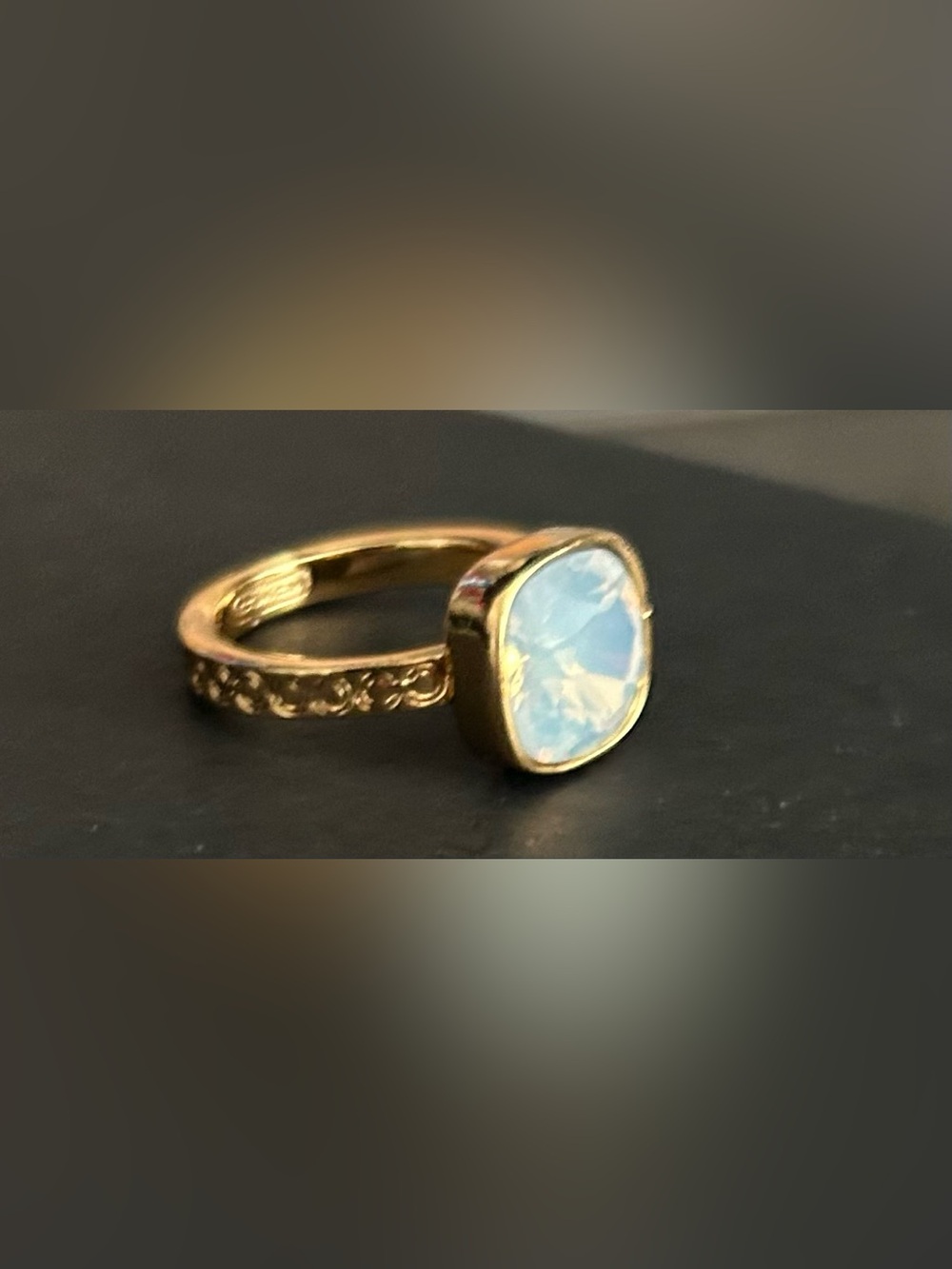 COACH Gold-Tone Ring with Opalescent Blue Cushion Stone